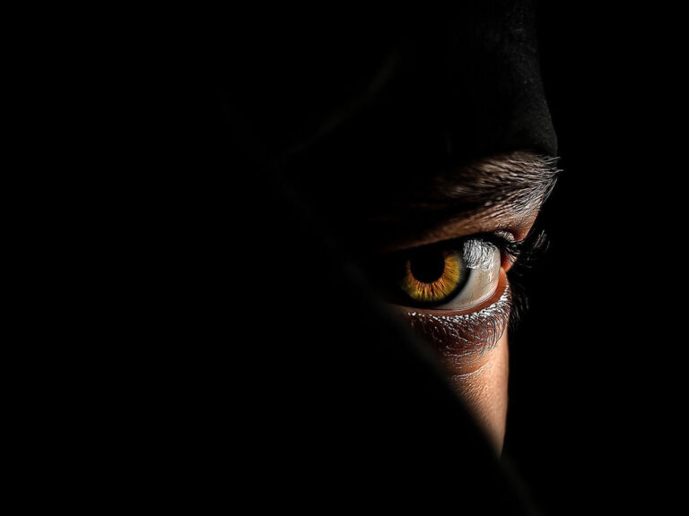 attacker looking from the darkness, at a student from WCKUK wing chun